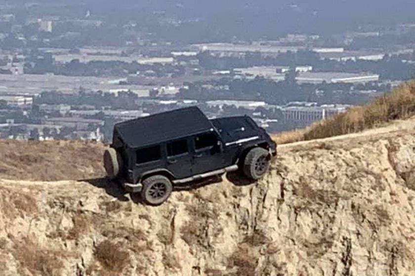 this-jeep-wrangler-got-stuck-at-the-top-of-a-ridge-(but-has-now-been-rescued)